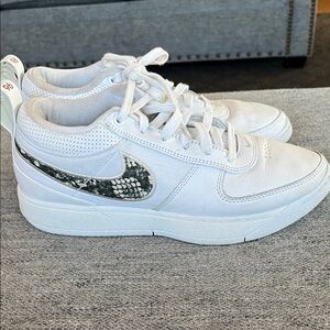 Nike White Low-Top Sneakers with Black Snakeskin Swoosh Accent